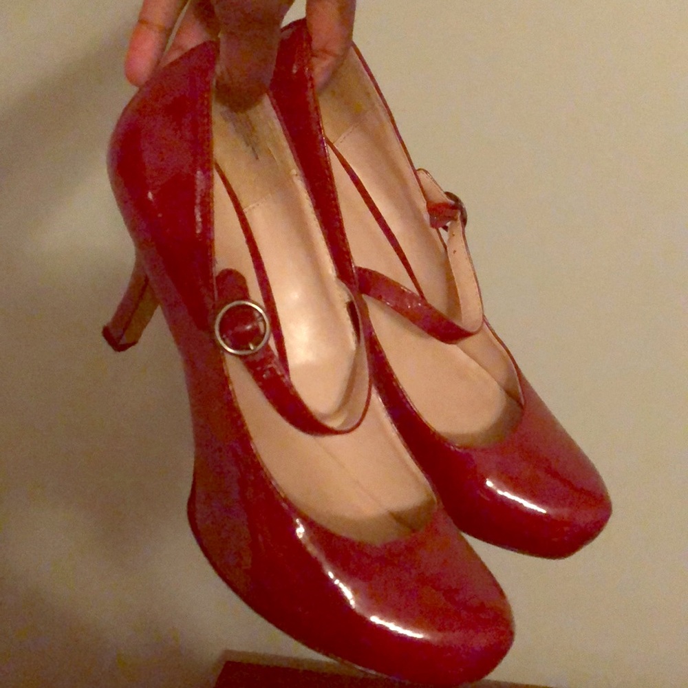 Red strap shoes.